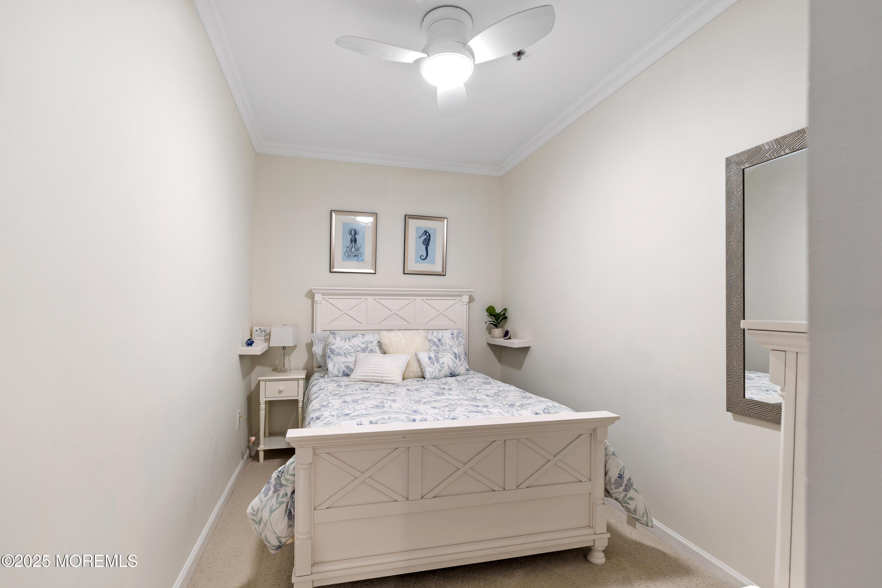 33 Cooper Avenue, Unit 208 Long Branch, NJ 07740 - Photo 22 of 43 a bedroom with a bed and a chandelier