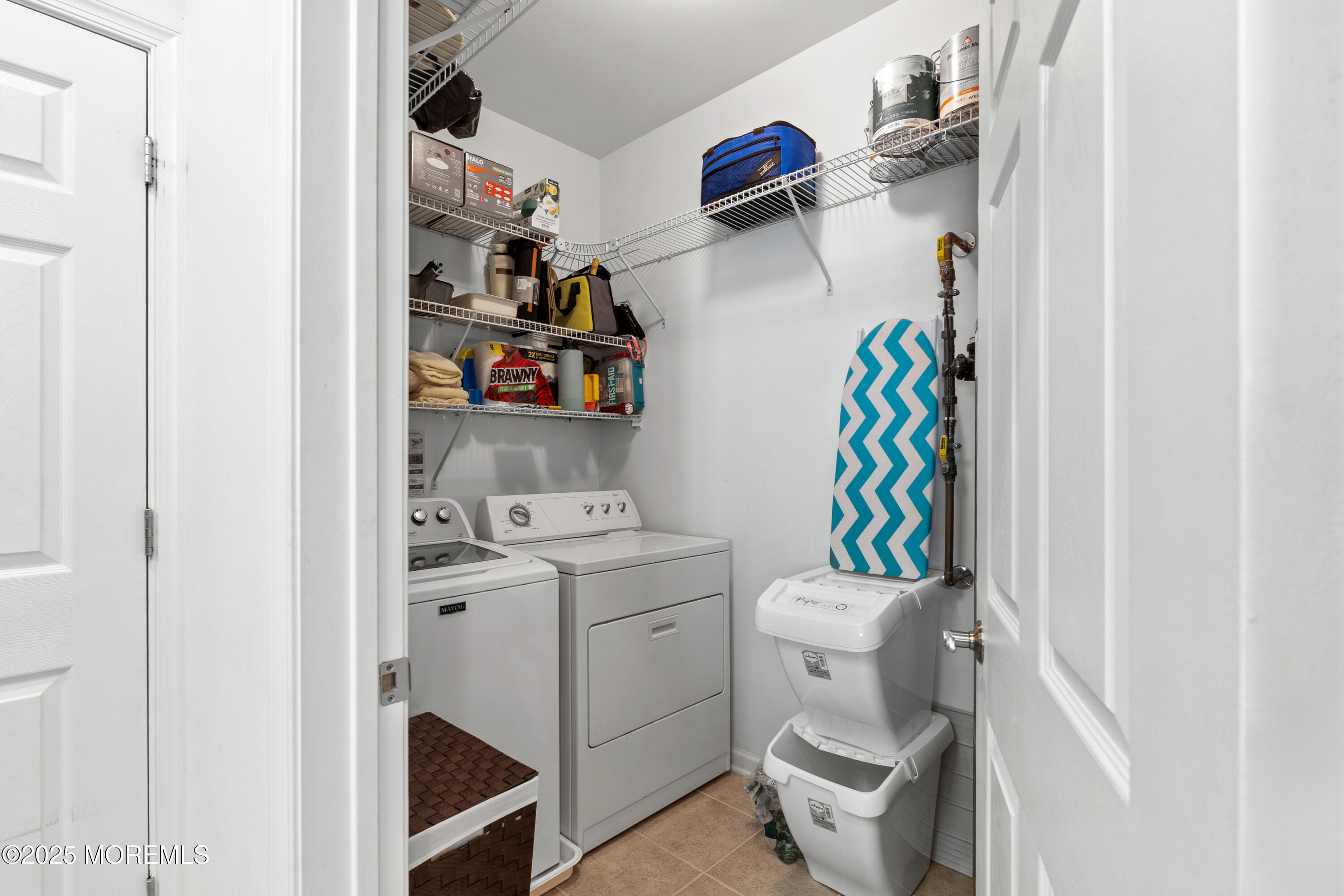 33 Cooper Avenue, Unit 208 Long Branch, NJ 07740 - Photo 26 of 43 a bathroom with a sink a toilet and a shower curtain