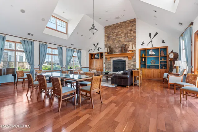 a living room with furniture dining table and a fireplace