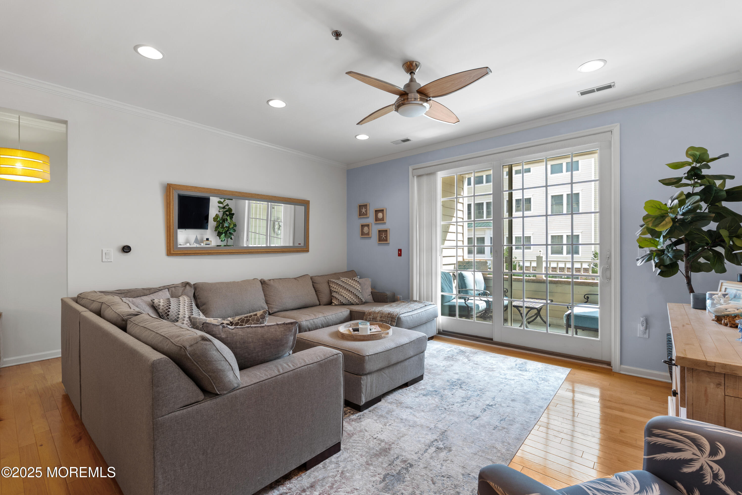 33 Cooper Avenue, Unit 208 Long Branch, NJ 07740 - Photo 7 of 43 a living room with furniture and a large window
