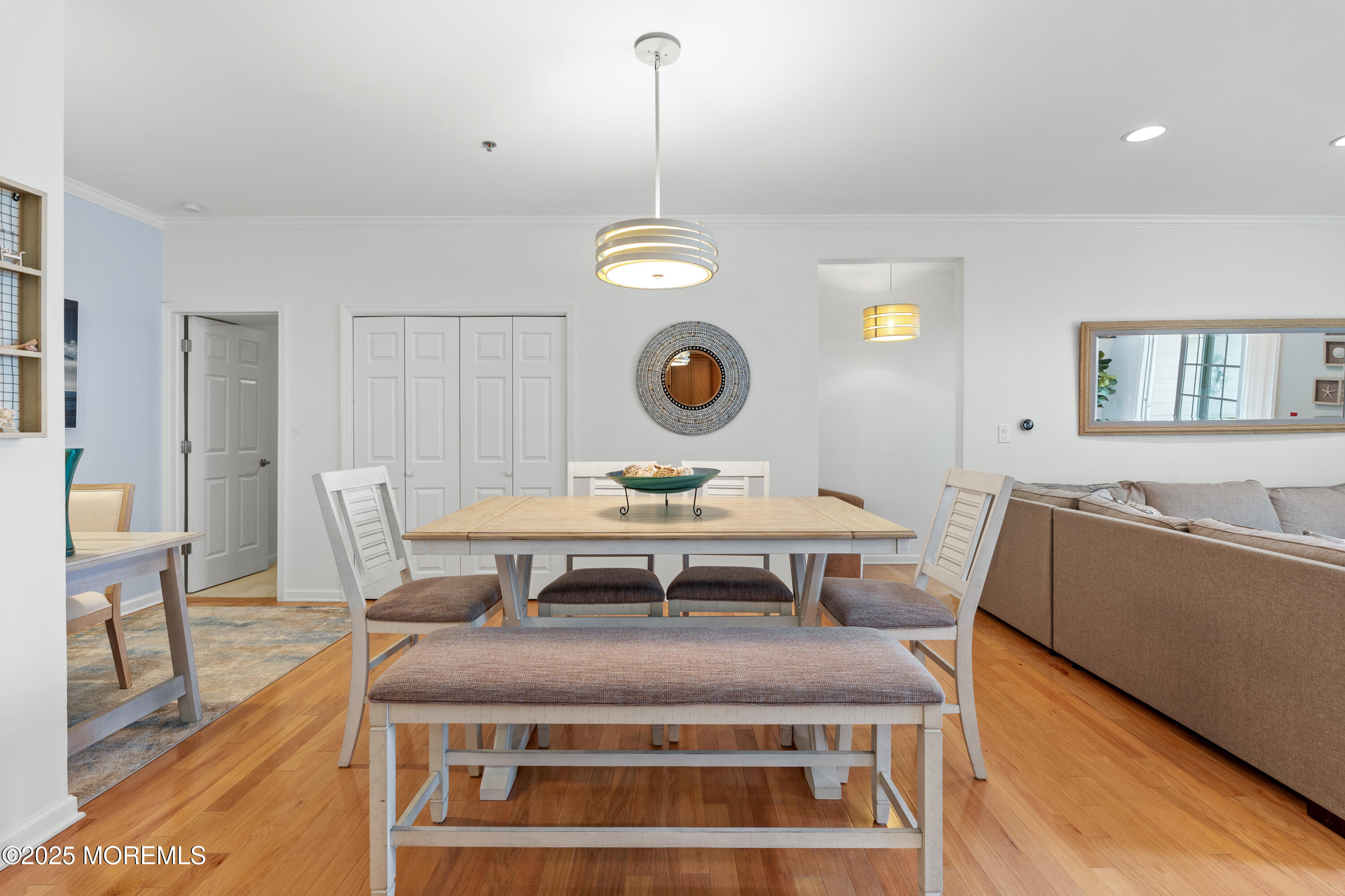33 Cooper Avenue, Unit 208 Long Branch, NJ 07740 - Photo 8 of 43 a living room with a table and chairs
