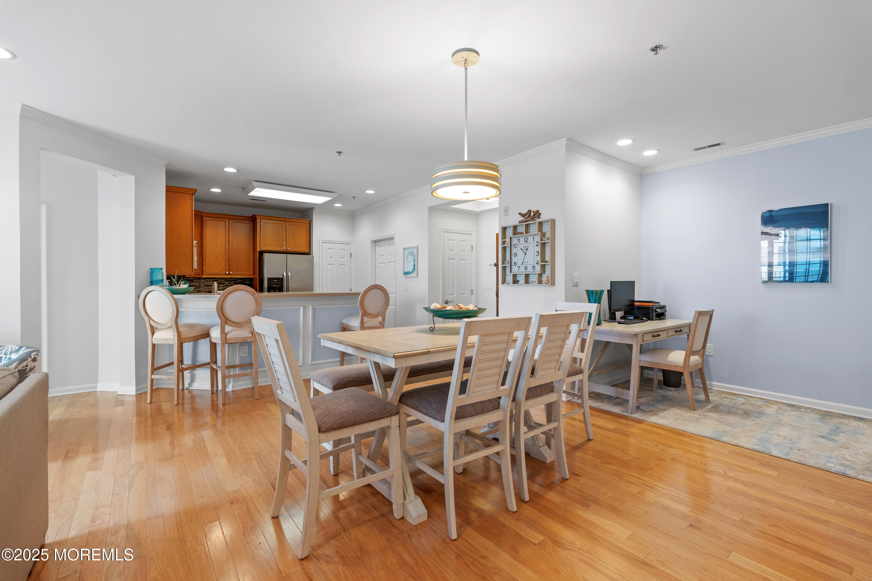 33 Cooper Avenue, Unit 208 Long Branch, NJ 07740 - Photo 9 of 43 a view of a dining room with furniture and wooden floor