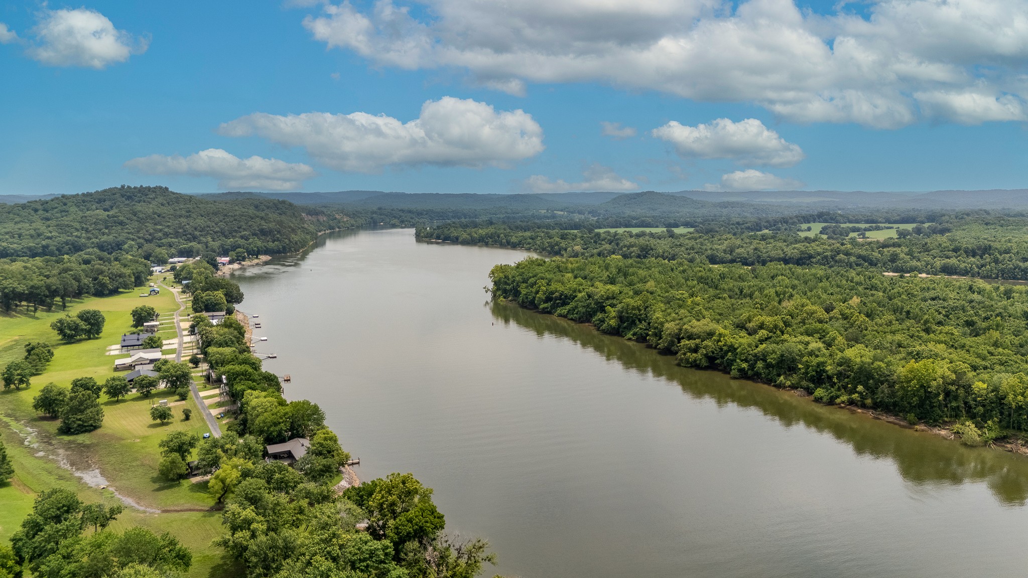 1038 WC PICKETT Road Clifton, TN 38425 - Photo 15 of 22 a view of a lake with a city