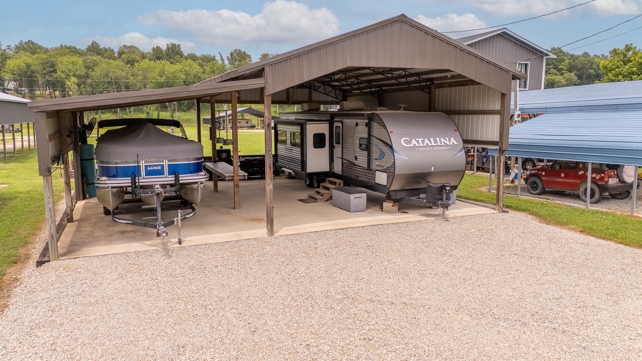 1038 WC PICKETT Road Clifton, TN 38425 - Photo 2 of 22 a view of a patio with a table and chairs under an umbrella