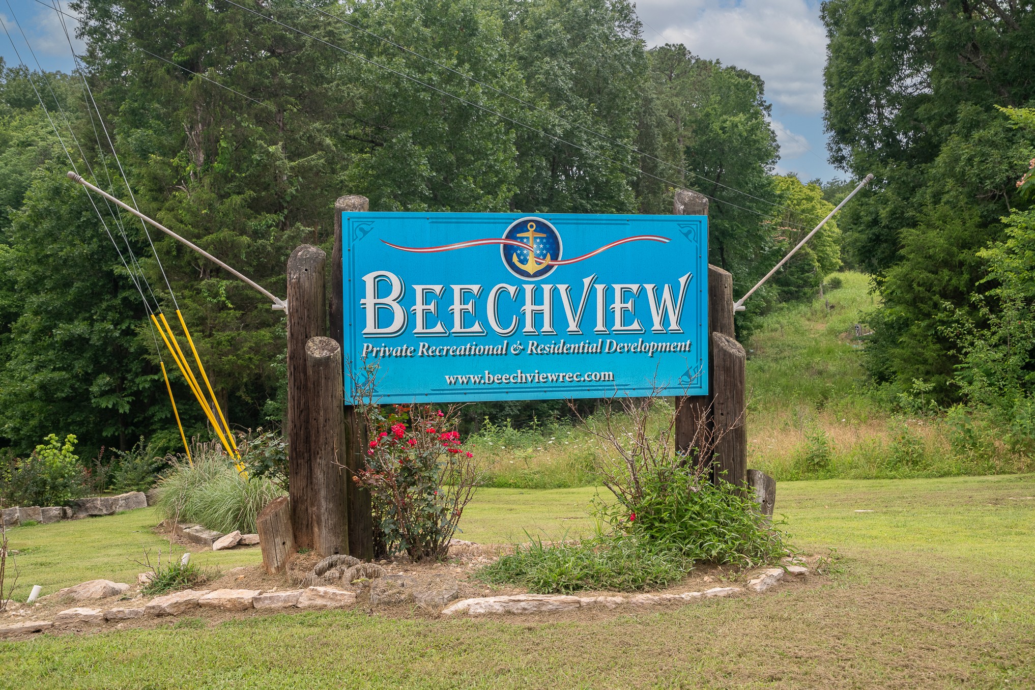 1038 WC PICKETT Road Clifton, TN 38425 - Photo 22 of 22 a view of a street sign under a large tree