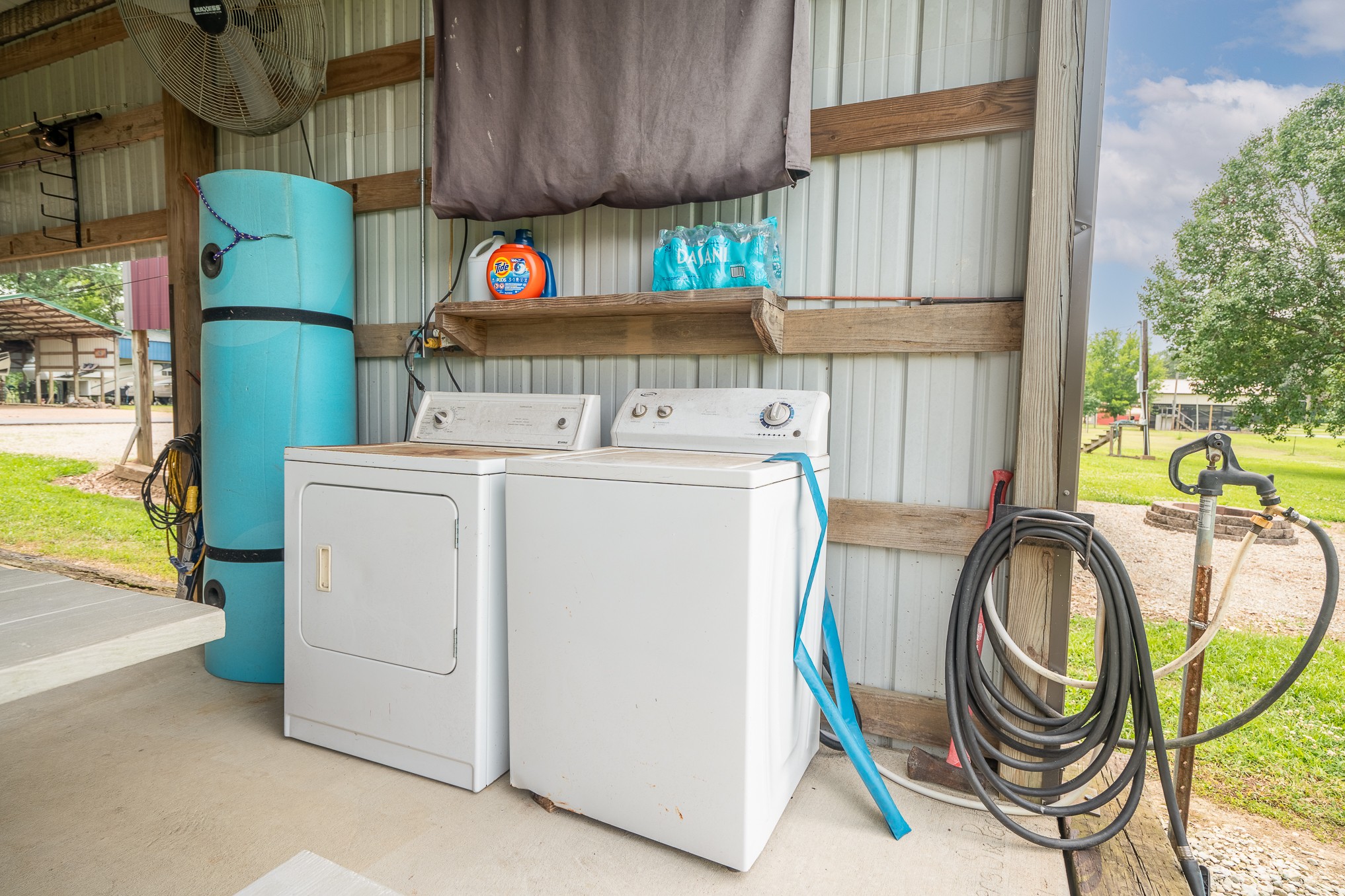 1038 WC PICKETT Road Clifton, TN 38425 - Photo 6 of 22 a utility room with dryer and washer