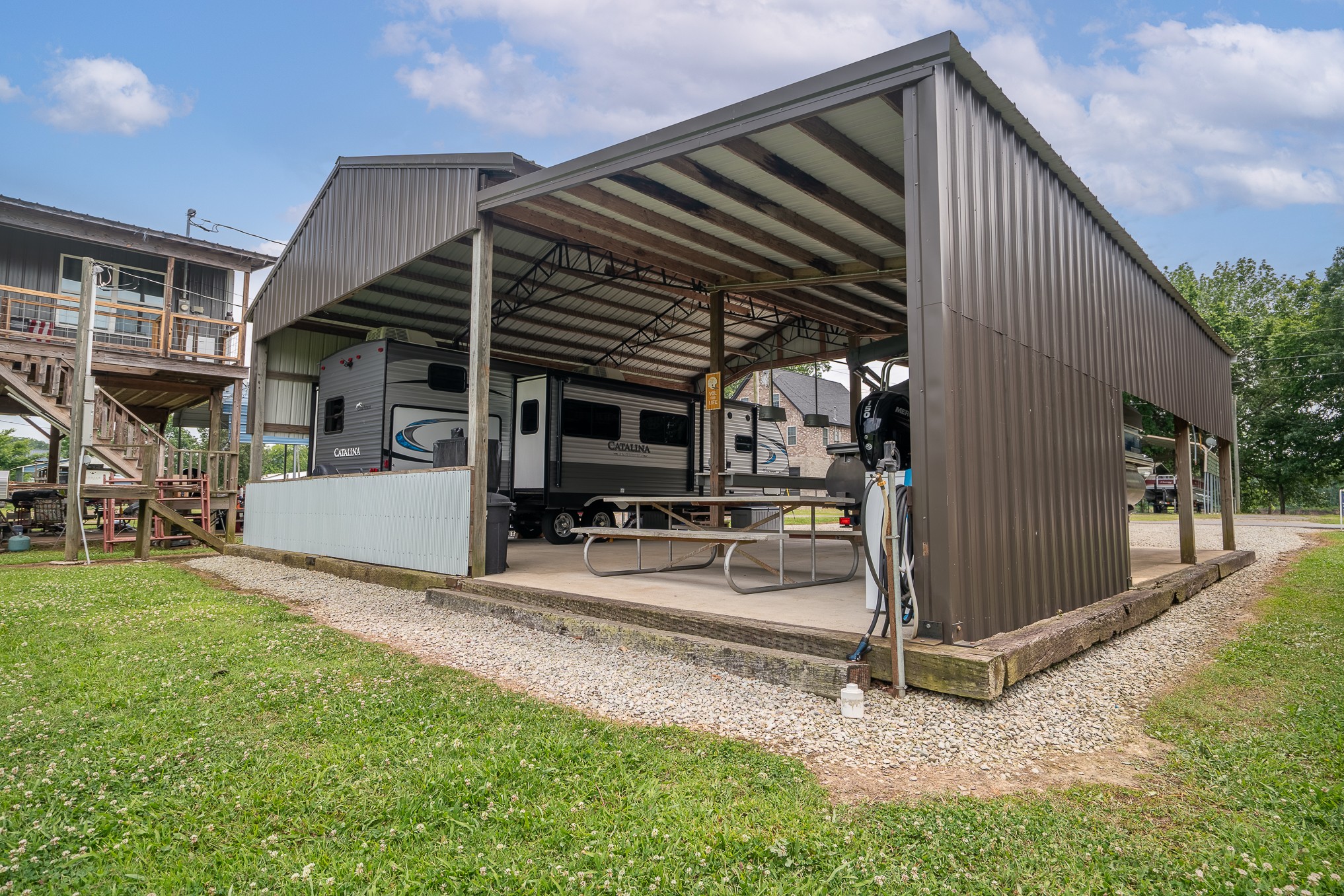 1038 WC PICKETT Road Clifton, TN 38425 - Photo 7 of 22 a view of a house with backyard and porch