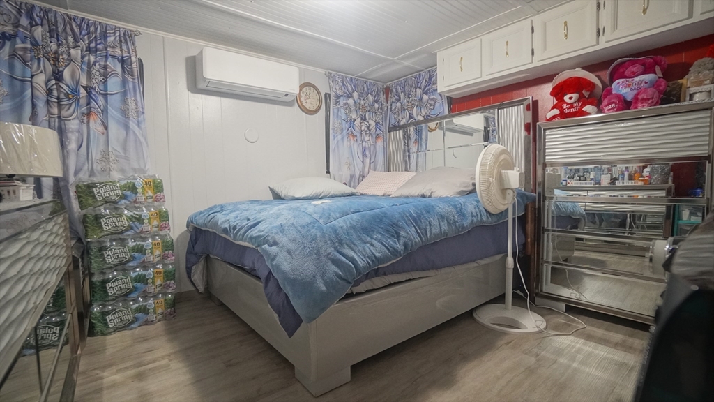 93 Grochmal Avenue, Unit 126 Springfield, MA 01151 - Photo 33 of 35 a bedroom with a bed and a window