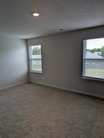 a view of a hallway to rooms