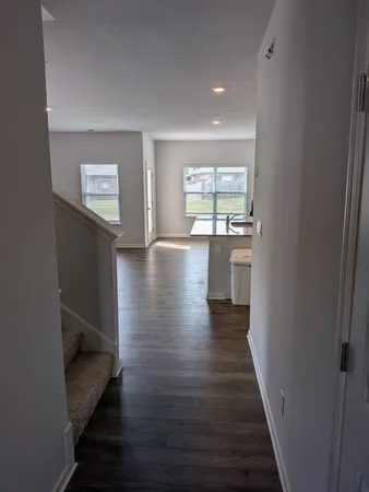 a view of gallery with wooden floor