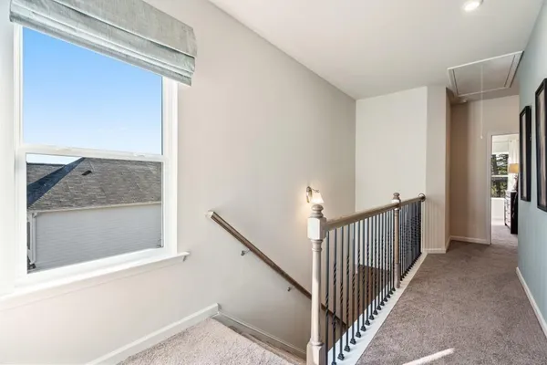 a view of a hallway view with staircase