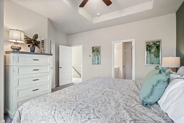 a bedroom with a bed and a dresser
