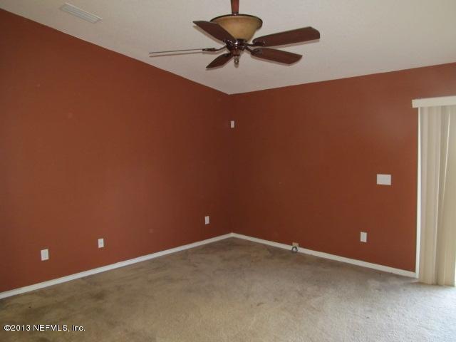 3269 Garden Brook Road Jacksonville, FL 32208 - Photo 4 of 8 a view of room with ceiling fan and window