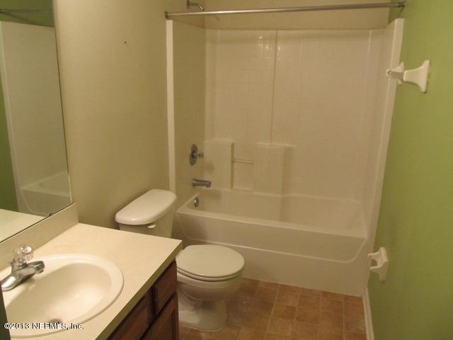 3269 Garden Brook Road Jacksonville, FL 32208 - Photo 5 of 8 a bathroom with a sink toilet and shower