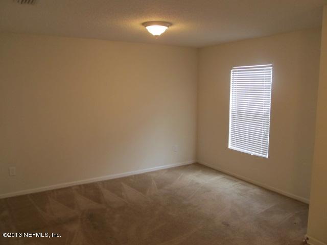 3269 Garden Brook Road Jacksonville, FL 32208 - Photo 7 of 8 a view of an empty room with a window