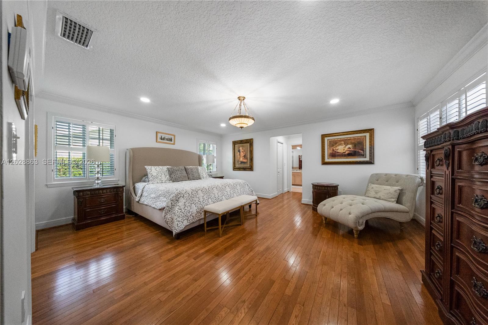15351 Southwest 146th Street Miami, FL 33196 - Photo 33 of 86 Entry view to Primary bedroom - elegant wood flooring.