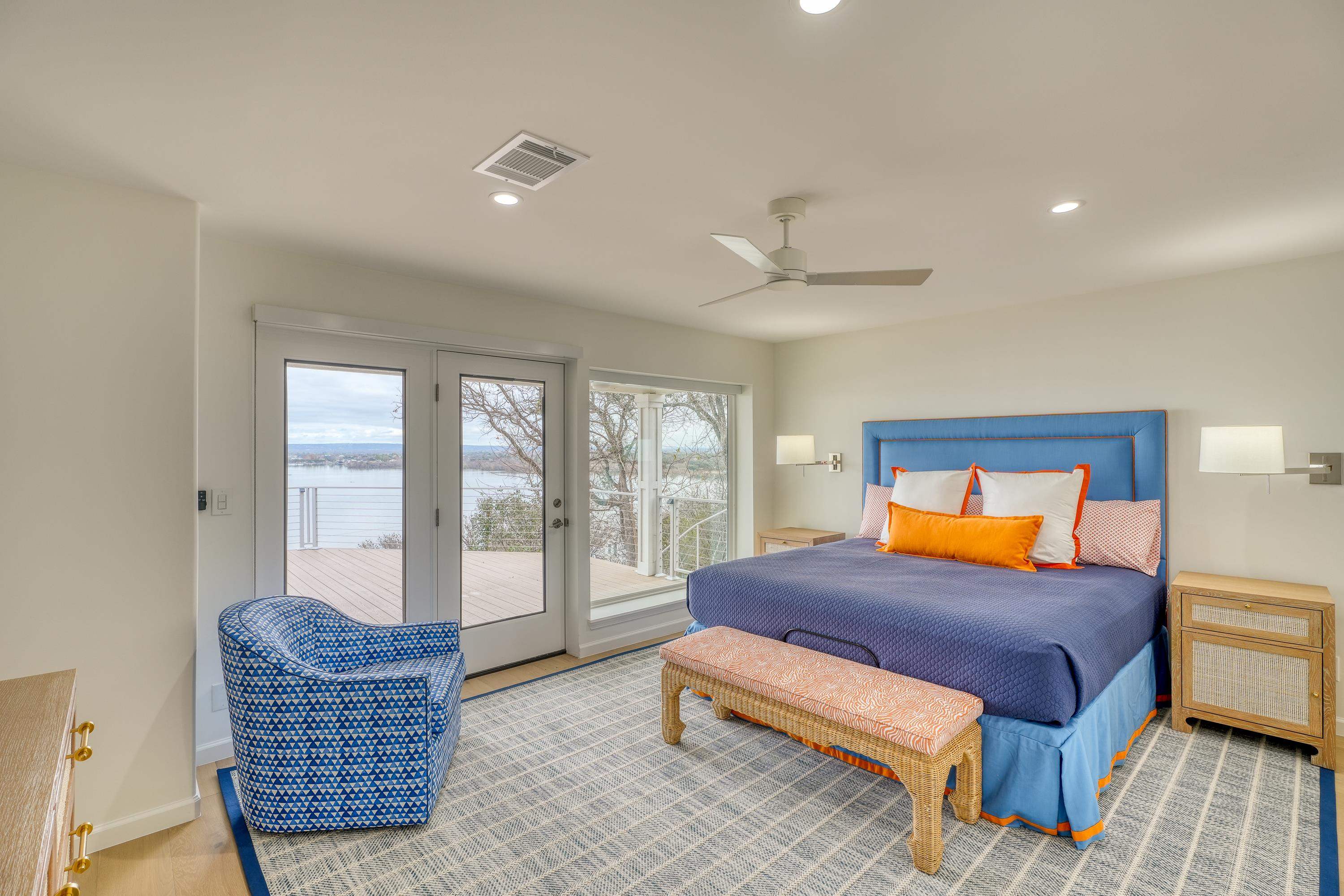 204 Blue Ridge Trail Horseshoe Bay, TX 78657 - Photo 13 of 28 a bedroom with a bed and wooden floor