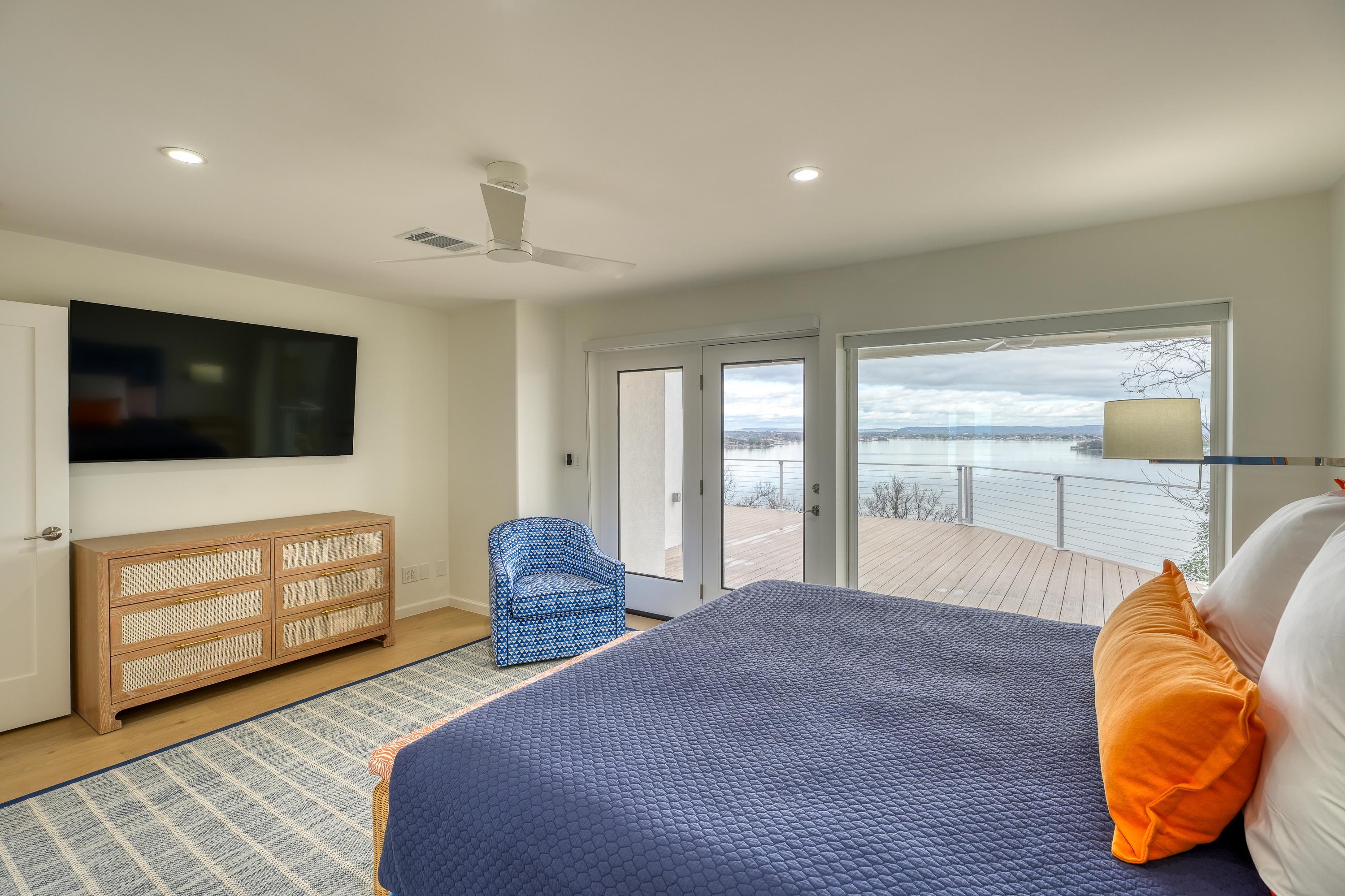 204 Blue Ridge Trail Horseshoe Bay, TX 78657 - Photo 14 of 28 a bedroom with a bed and wooden floor