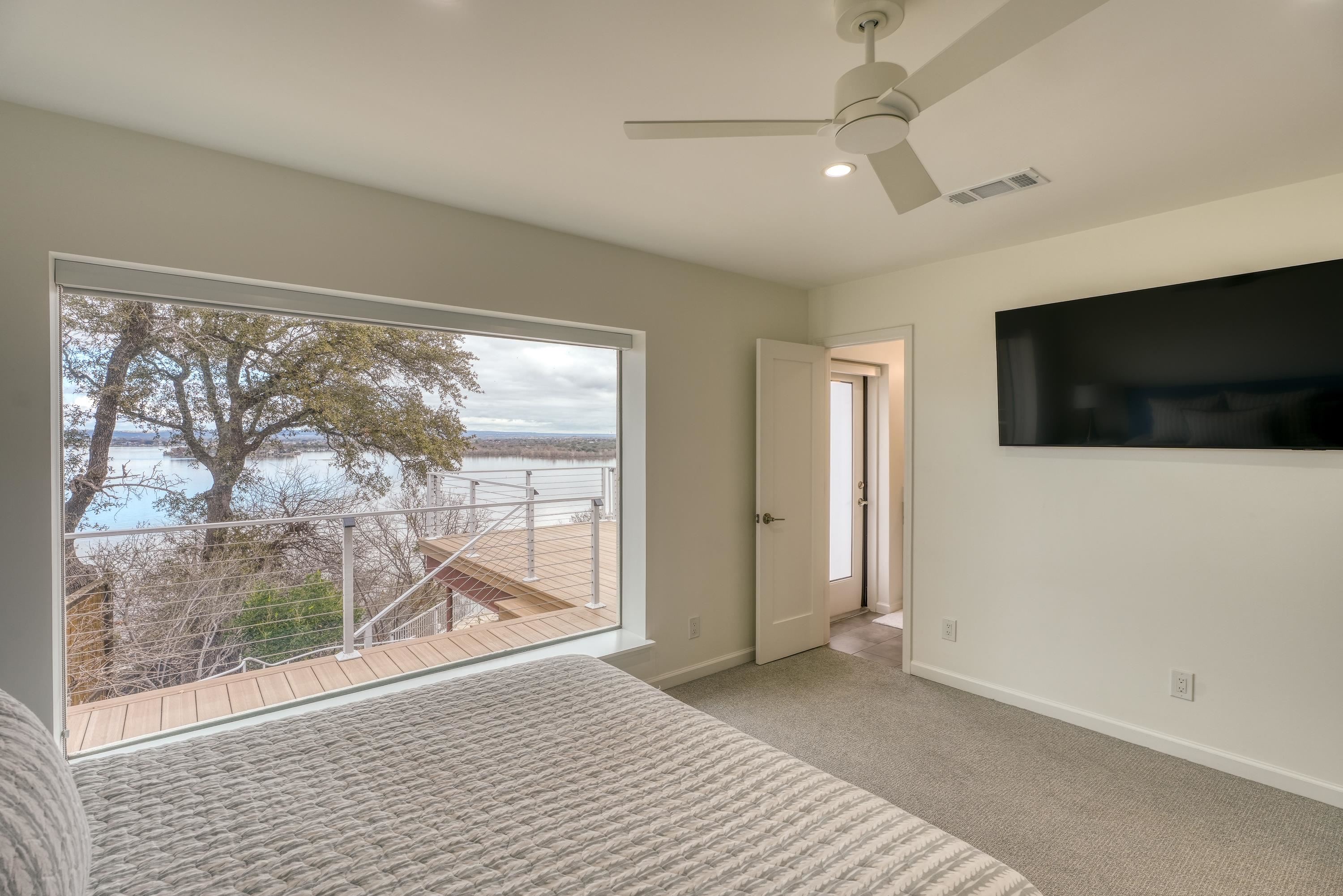 204 Blue Ridge Trail Horseshoe Bay, TX 78657 - Photo 18 of 28 a view of a livingroom with an empty space and a flat screen tv