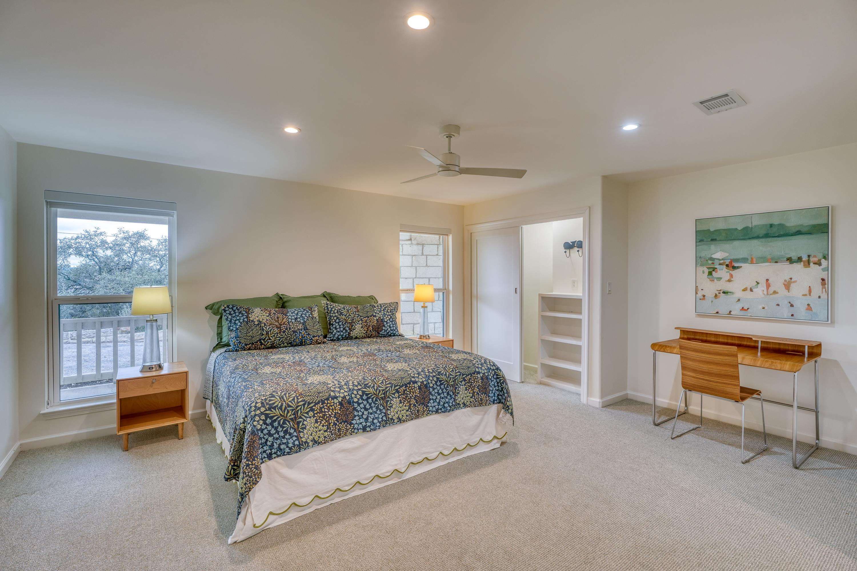 204 Blue Ridge Trail Horseshoe Bay, TX 78657 - Photo 20 of 28 a bedroom with a bed and a cabinets