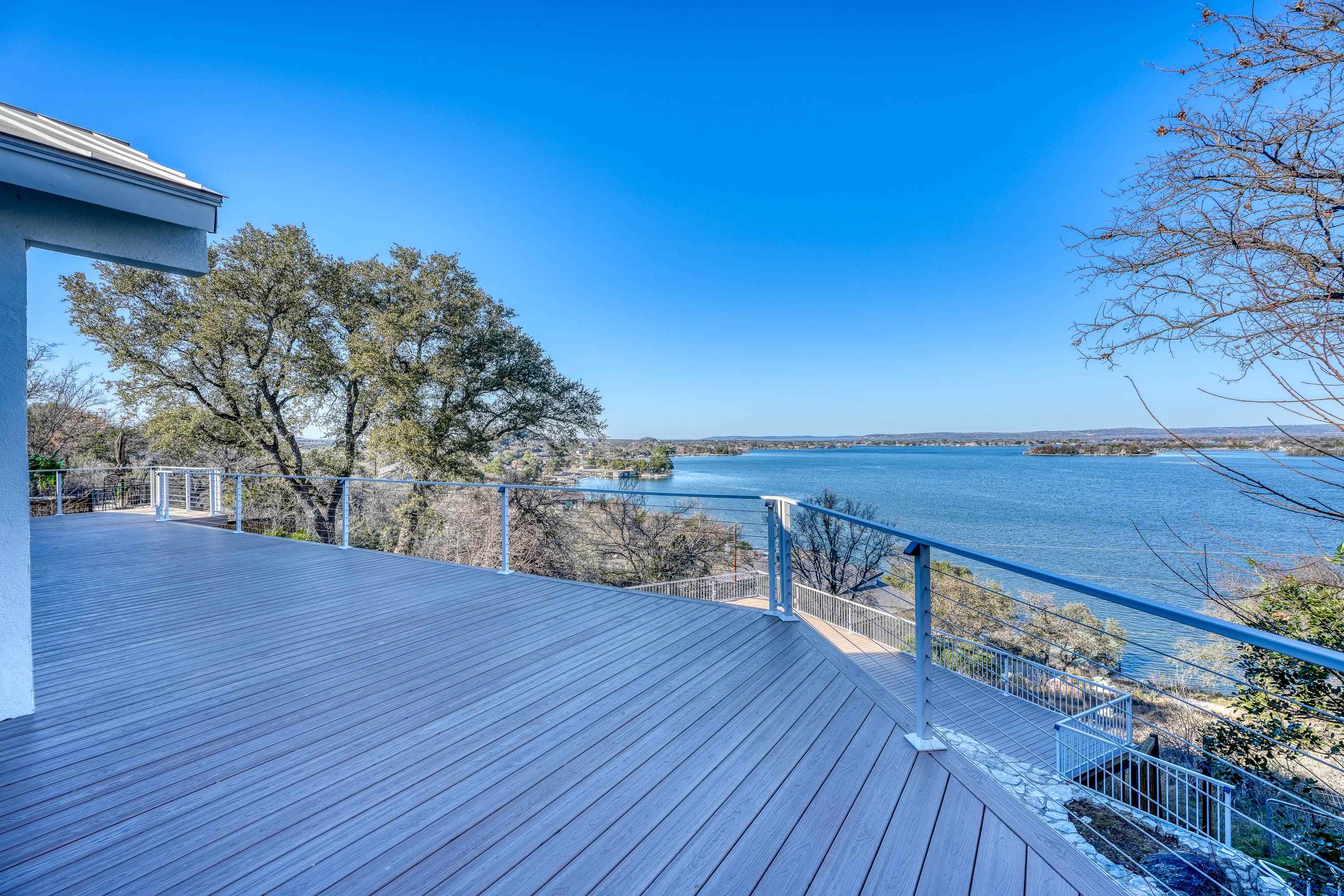 204 Blue Ridge Trail Horseshoe Bay, TX 78657 - Photo 24 of 28 a view of a terrace with wooden floor and fence