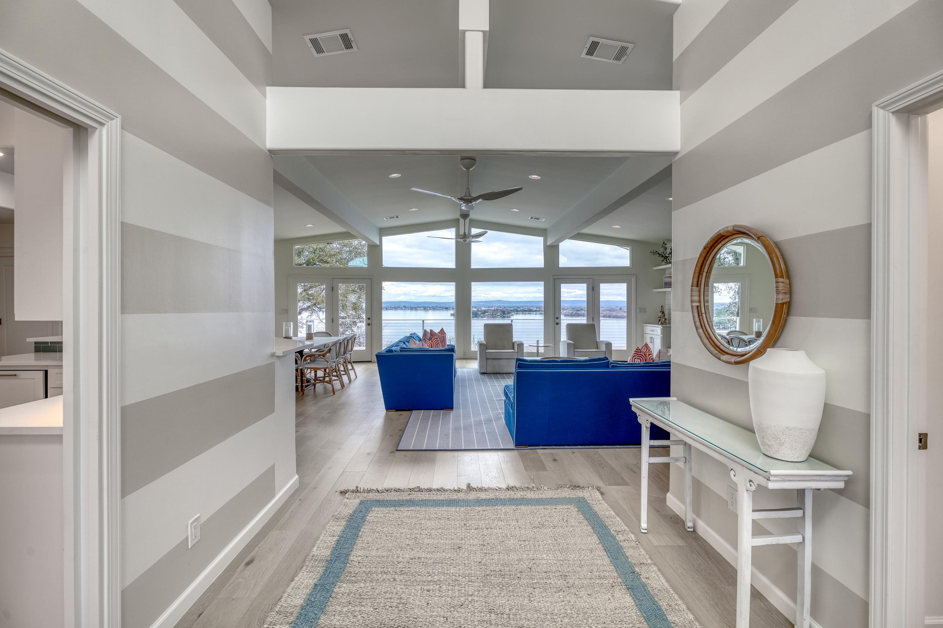 204 Blue Ridge Trail Horseshoe Bay, TX 78657 - Photo 4 of 28 a living room with furniture a fireplace and a large window