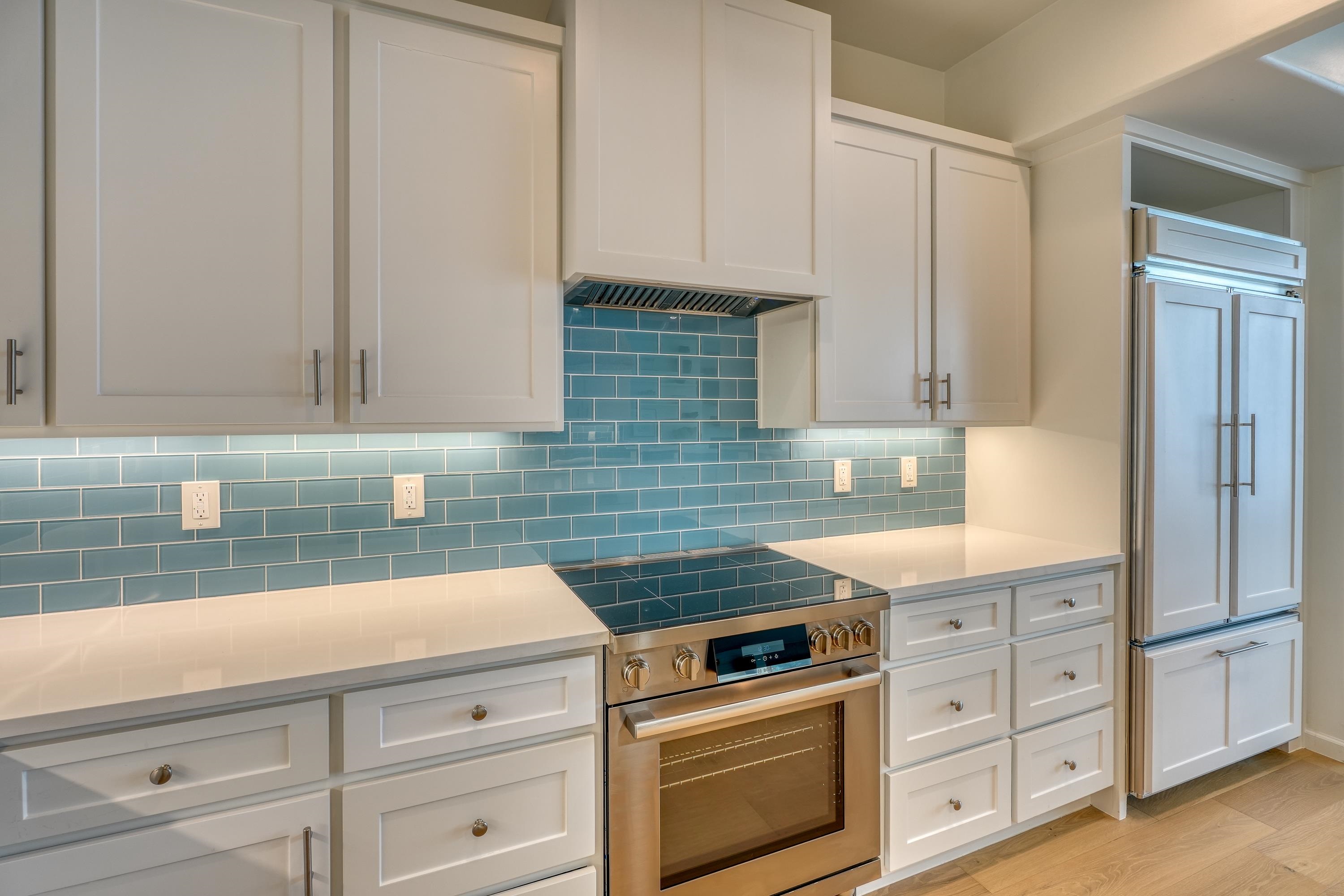 204 Blue Ridge Trail Horseshoe Bay, TX 78657 - Photo 9 of 28 a kitchen with cabinets appliances and a sink