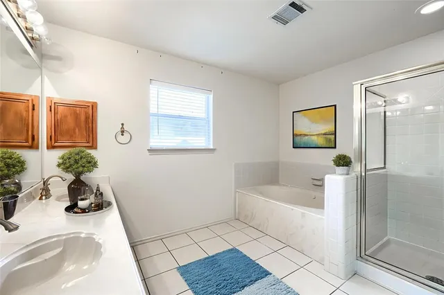 a bathroom with a sink vanity and mirror