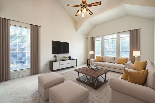 a living room with furniture and a flat screen tv