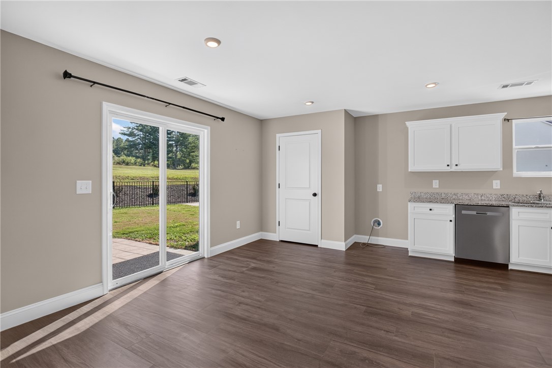 2007 Aberdeen Lane Walhalla, SC 29691 - Photo 7 of 41 Sliding doors access a private patio with expansive backyard views, perfect for outdoor living.
