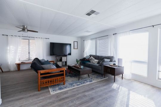 1221 Nocturne Street Ridgecrest, CA 93555 - Photo 6 of 32 a living room with furniture and a flat screen tv