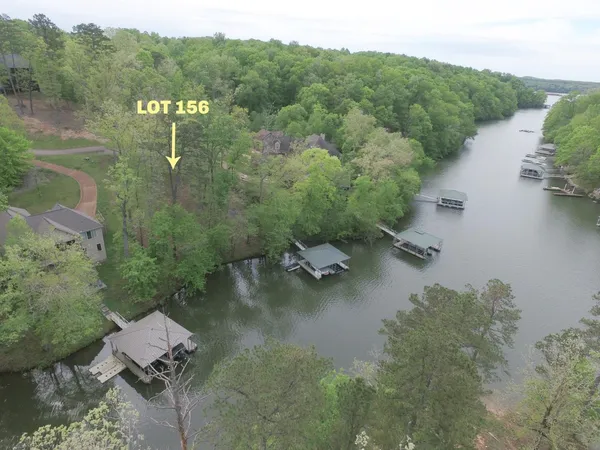 an aerial view of a house with a lake view
