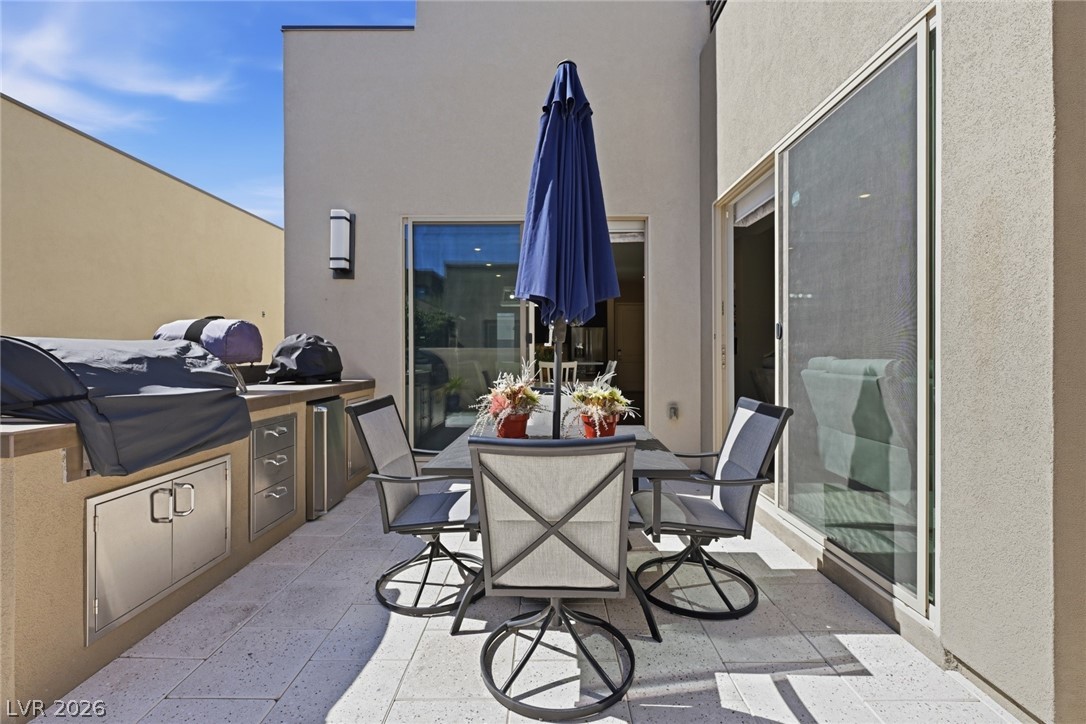 4246 Swift Street Las Vegas, NV 89135 - Photo 48 of 71 View of patio / terrace with an outdoor kitchen / dining area