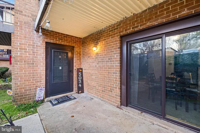 a view of a brick house with a large door