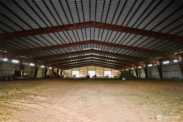a view of a park with wooden fence