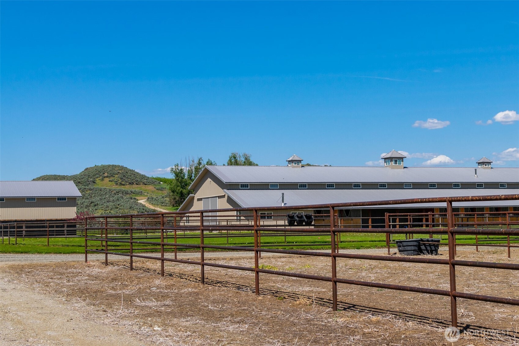 2034 North Pine Creek Road Tonasket, WA 98855 - Photo 27 of 38 a view of a park with wooden fence