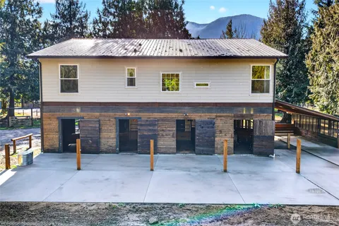 a front view of a house with garage