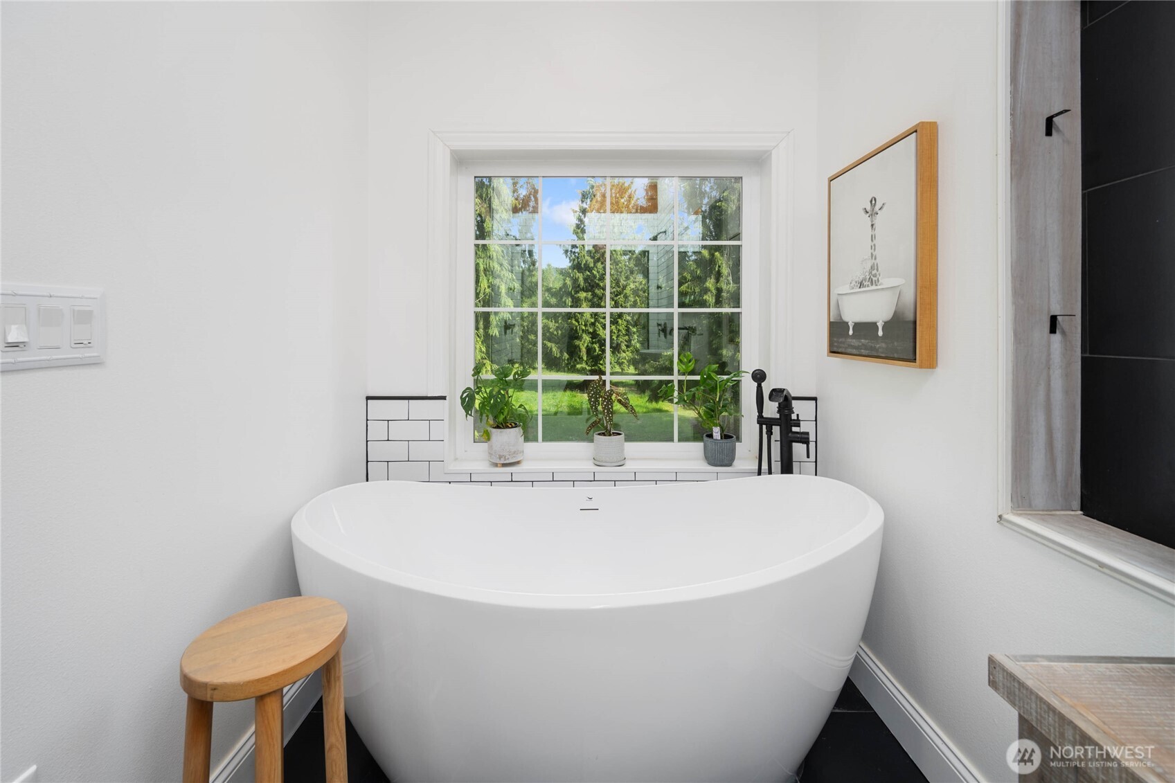 8349 Birdsview Meadows Lane Concrete, WA 98237 - Photo 13 of 38 a white bath tub sitting in a bathroom next to a window