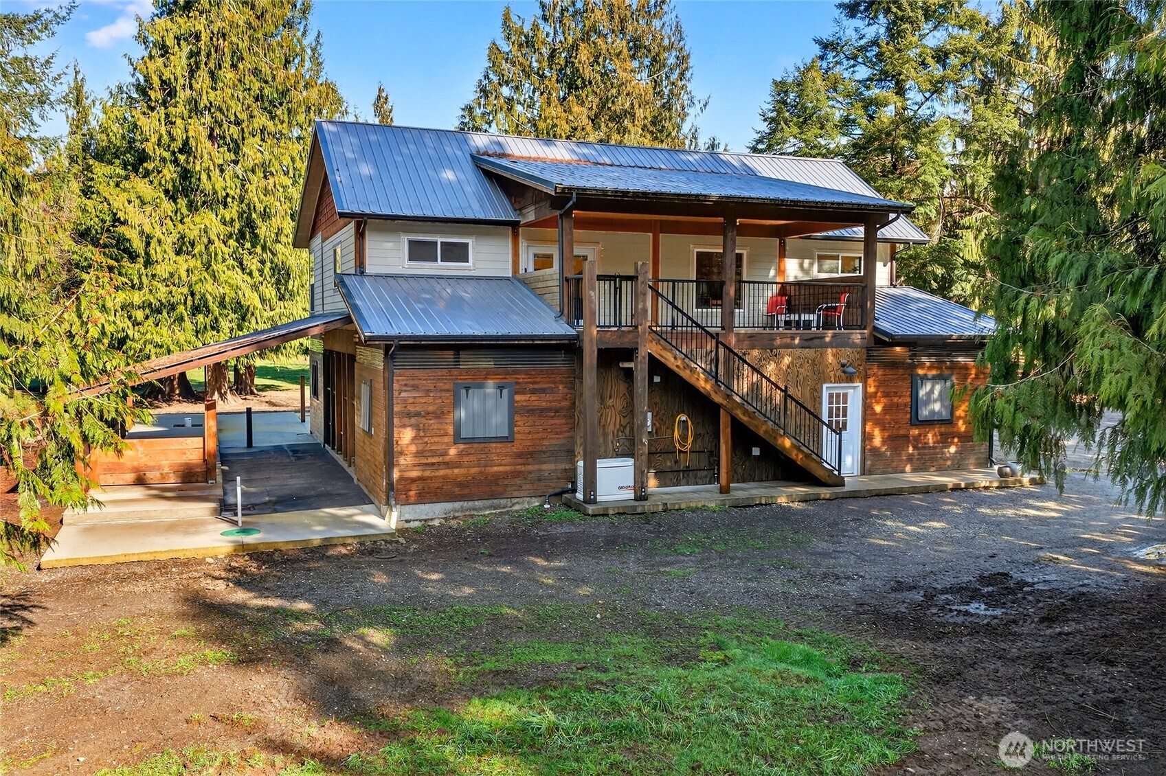 8349 Birdsview Meadows Lane Concrete, WA 98237 - Photo 26 of 38 a front view of a house with a garage