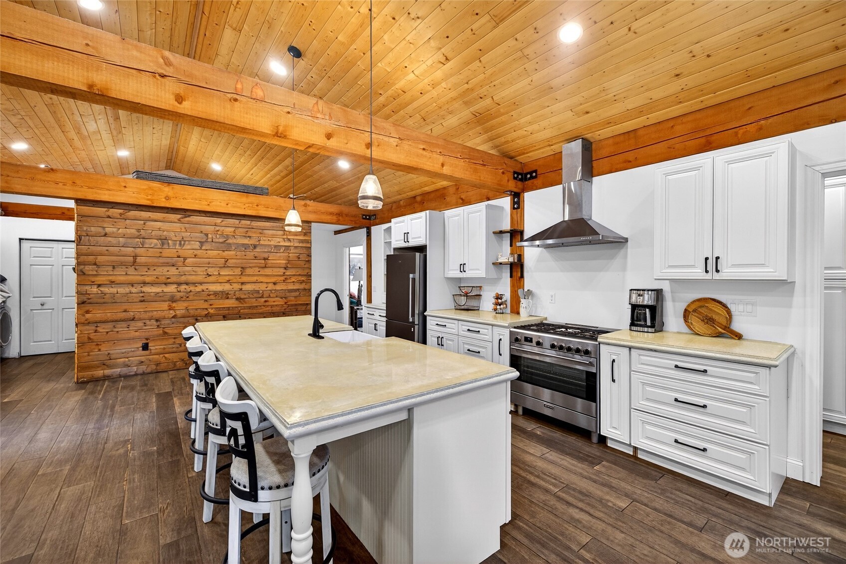 8349 Birdsview Meadows Lane Concrete, WA 98237 - Photo 6 of 38 a kitchen with a stove a refrigerator and wooden floor