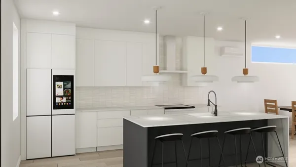 a kitchen with white cabinets and sink