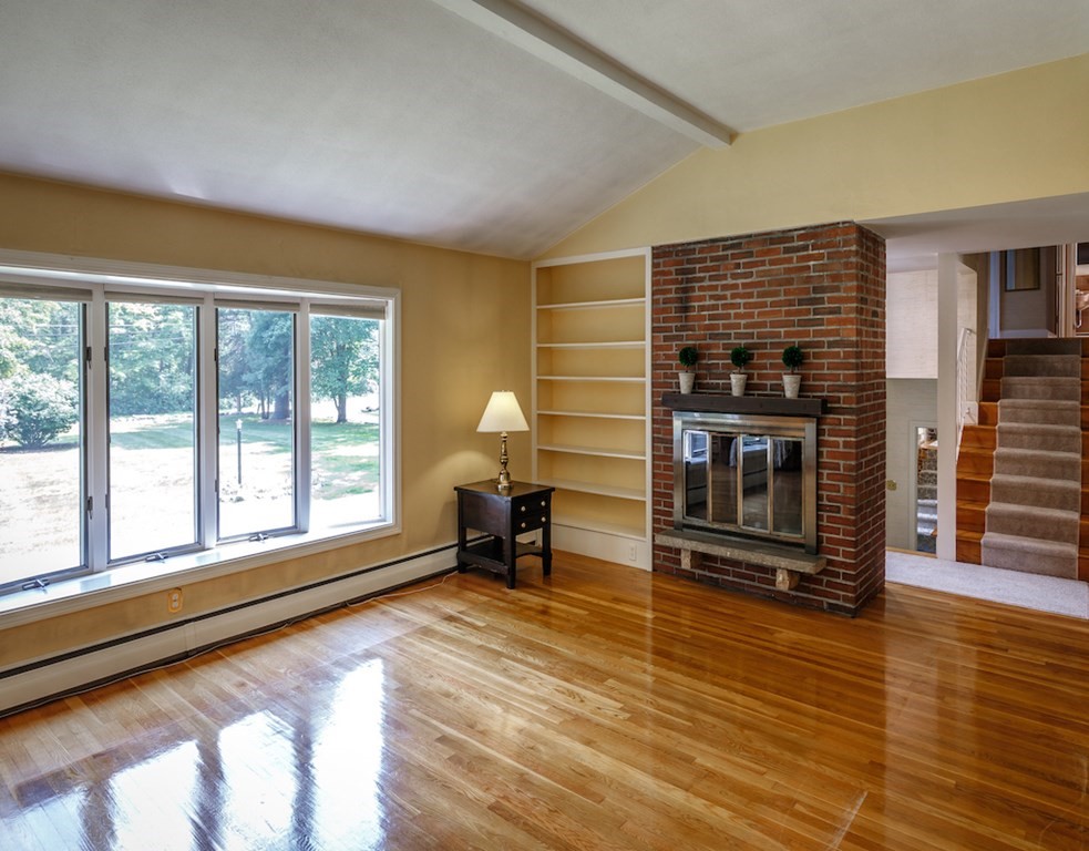 182 Wayside Inn Road Sudbury, MA 01776 - Photo 16 of 42 a living room with furniture and a fireplace