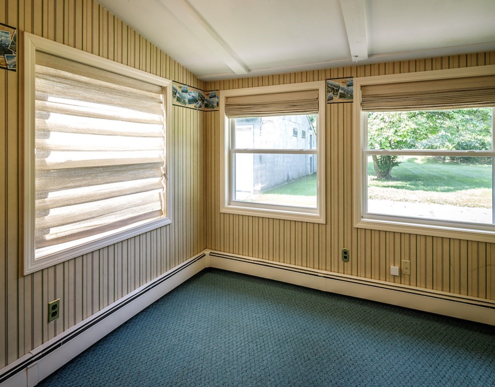 182 Wayside Inn Road Sudbury, MA 01776 - Photo 30 of 42 a view of an empty room with wooden floor and a window
