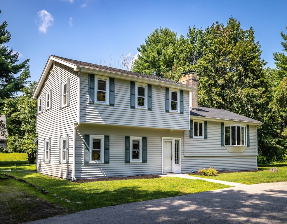 182 Wayside Inn Road Sudbury, MA 01776 - Photo 4 of 42 a front view of house with yard and green space