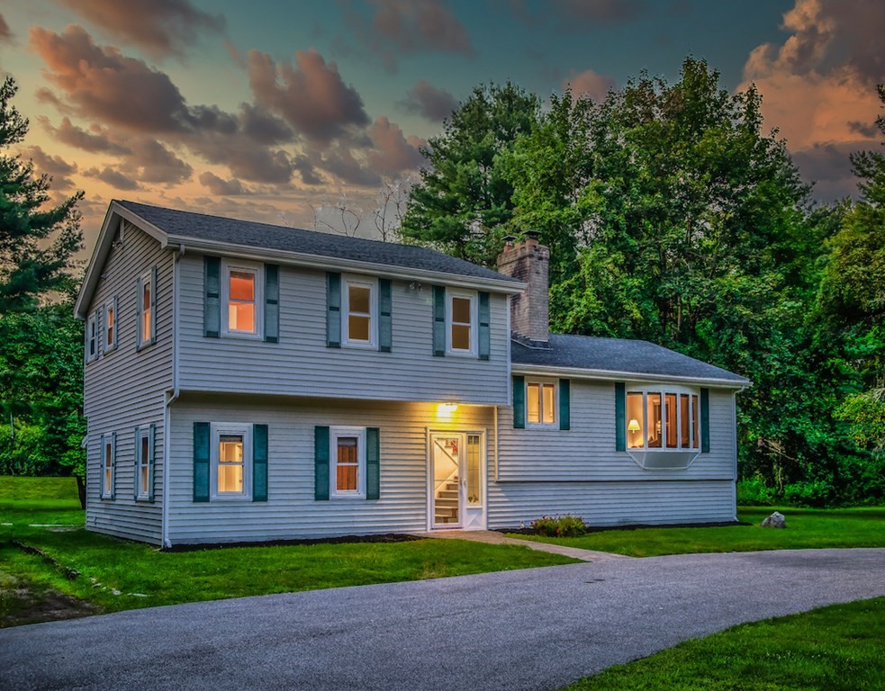 182 Wayside Inn Road Sudbury, MA 01776 - Photo 41 of 42 a front view of a house with a yard and garage