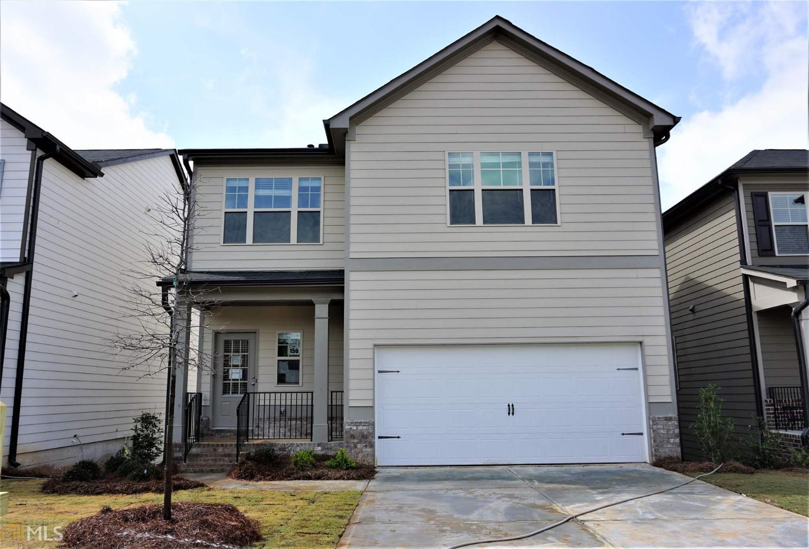 588 Summit Point, Unit 150 Canton, GA 30114 - Photo 1 of 1 a front view of a house with garden
