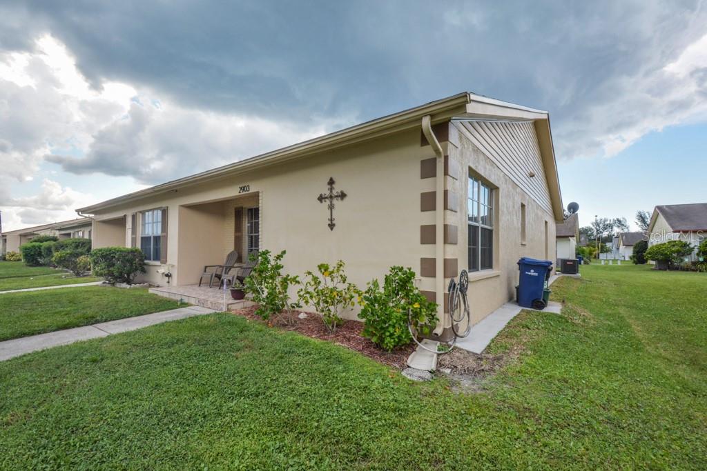 2903 Wainwright Court New Port Richey, FL 34655 - Photo 1 of 1 a front view of house with yard and outdoor seating