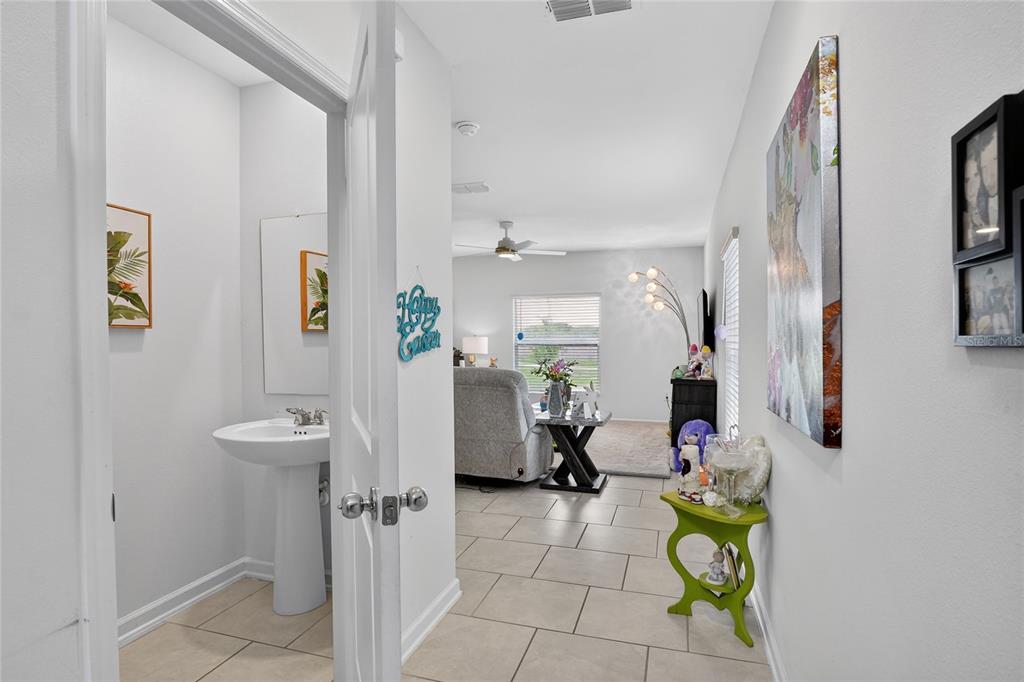 545 Bell Prairie Circle Lake Wales, FL 33859 - Photo 14 of 42 a bathroom with a sink mirror and toilet