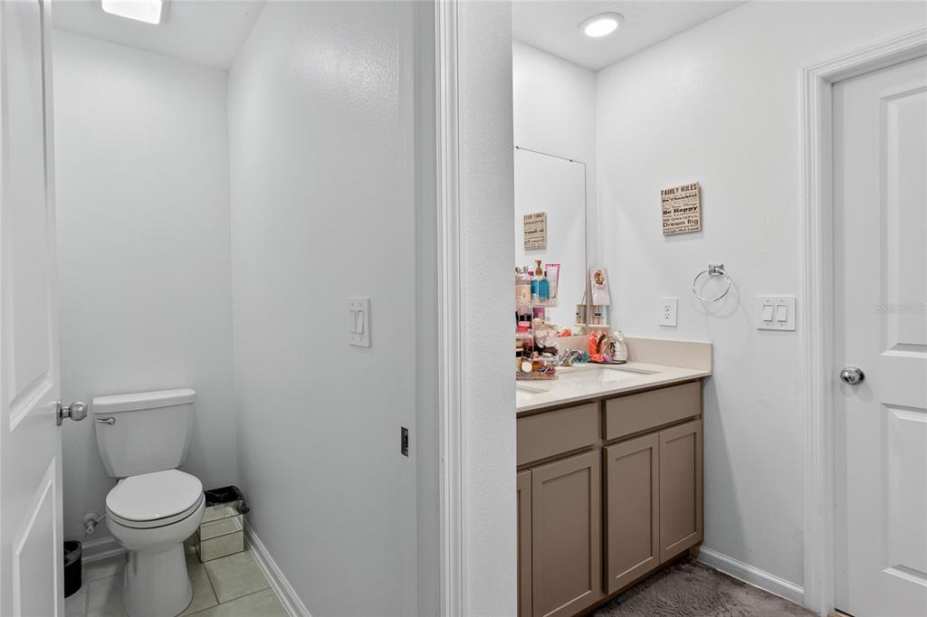 545 Bell Prairie Circle Lake Wales, FL 33859 - Photo 21 of 42 a bathroom with a sink toilet and a mirror