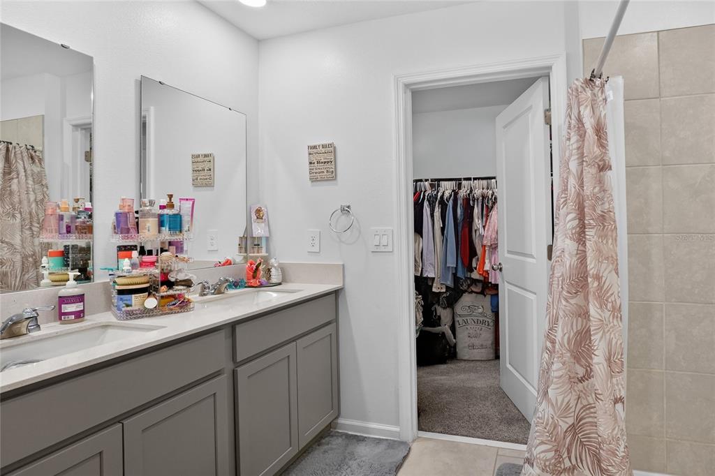 545 Bell Prairie Circle Lake Wales, FL 33859 - Photo 22 of 42 a bathroom with a sink and a mirror